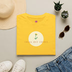 Small But Fierce Women's Minimalist T-Shirt in vibrant yellow with flower graphic and clean crew neckline.